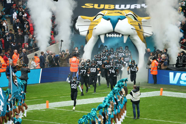 Lerentee McCray of the Jacksonville Jaguars leads his team out onto the pitch prior to the NFL match between the Houston Texans and Jacksonville...