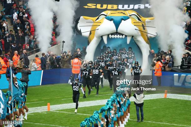 Lerentee McCray of the Jacksonville Jaguars leads his team out onto the pitch prior to the NFL match between the Houston Texans and Jacksonville...