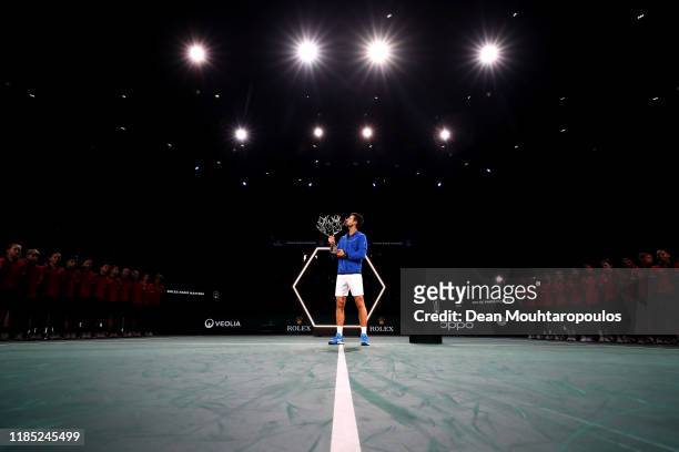 Novak Djokovic of Serbia celebrates with the trophy after victory in the Men's Singles Final match against Denis Shapovalov of Canada on day 7 of the...