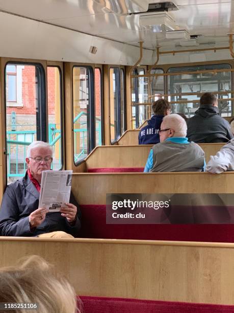 inside the cable railway in dresden - man in car reading newspaper stock pictures, royalty-free photos & images