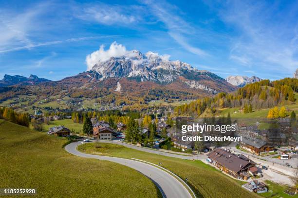 cortina d'ampezzo with pomagagnon mount in background, dolomites, italy, south tyrol. - cortina dampezzo stock pictures, royalty-free photos & images