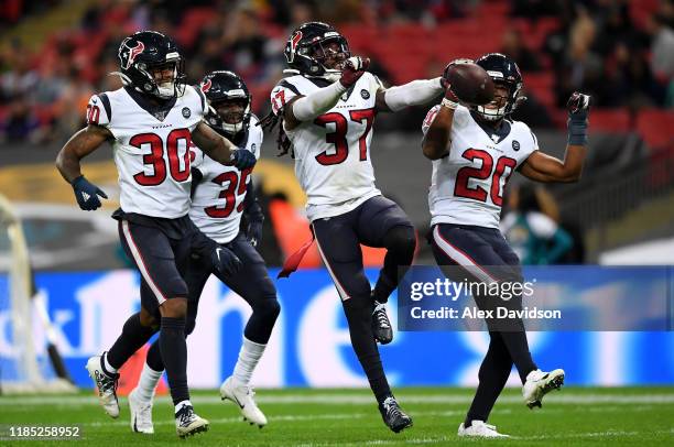 Jahleel Addae of Houston Texans celebrates a interception with his teammates during the NFL game between Houston Texans and Jacksonville Jaguars at...