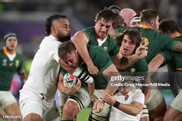 Duane Vermeulen of South Africa driven forward by team mate Eben Etzebeth under pressure from Billy Vunipola and Ben Youngs of England during the...