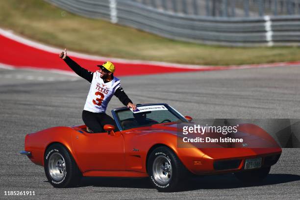 Daniel Ricciardo of Australia and Renault Sport F1 waves to the crowd on the drivers parade before the F1 Grand Prix of USA at Circuit of The...
