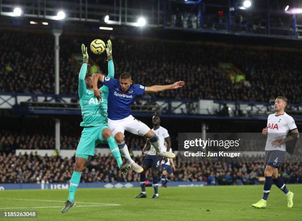 Paulo Gazzaniga of Tottenham Hotspur challenges for the high ball with Richarlison of Everton during the Premier League match between Everton FC and...