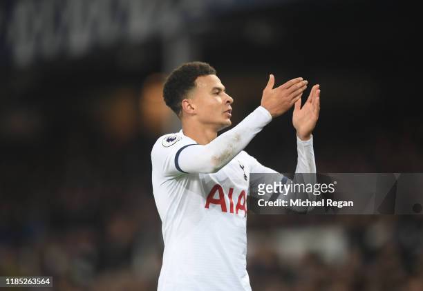 Dele Alli of Tottenham Hotspur celebrates after scoring his sides first goal during the Premier League match between Everton FC and Tottenham Hotspur...