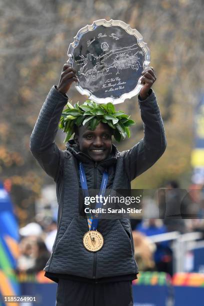 Joyciline Jepkosgei of Kenya poses with the trophy after winning the Womens' Division of the 2019 TCS New York City Marathon on November 03, 2019 in...