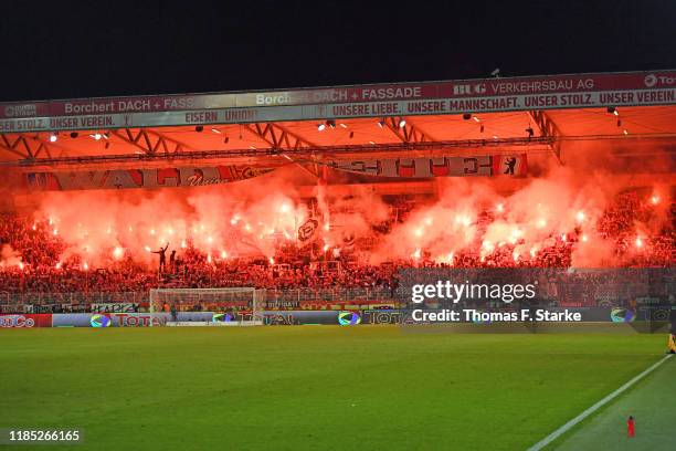 Supporters of Union light flares during the Bundesliga match between 1. FC Union Berlin and Hertha BSC at Stadion An der Alten Foersterei on November...