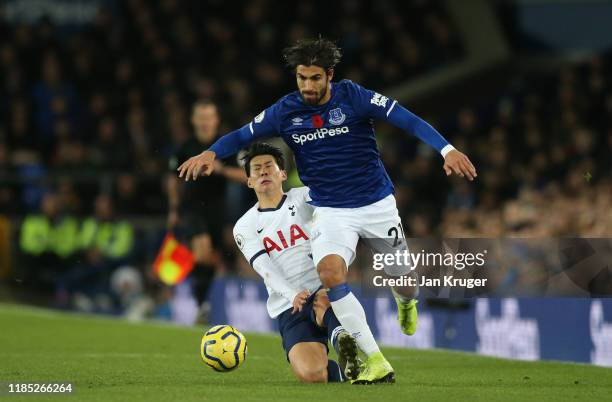 Andre Gomes of Everton is tackled by Son Heung-Min of Tottenham Hotspur during the Premier League match between Everton FC and Tottenham Hotspur at...