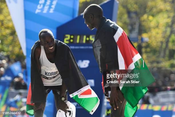 Geoffrey Kamworor, of Kenya, right, reacts with Albert Korir of Kenya after finishing in the top two of the Men's Division of the 2019 TCS New York...