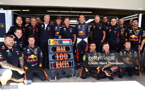 The Red Bull Racing team pose for a photo to commemorate the 100th Formula One race of Max Verstappen of Netherlands and Red Bull Racing before the...