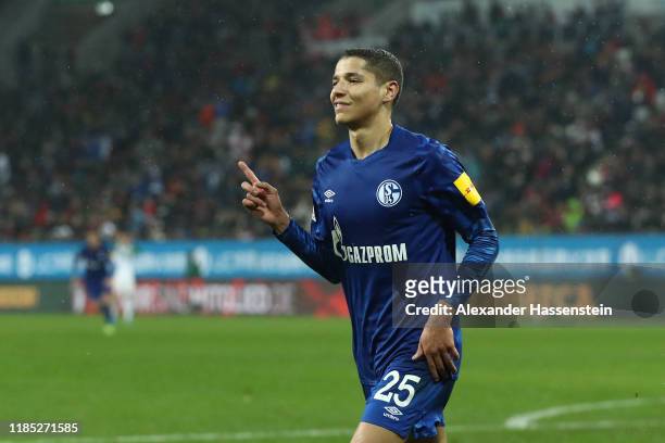 Amine Harit of Schalke celebrates scoring the 3rd team goal during the Bundesliga match between FC Augsburg and FC Schalke 04 at WWK-Arena on...