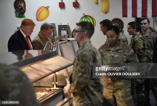 President Donald Trump serves Thanksgiving dinner to US troops at Bagram Air Field during a surprise visit on November 28, 2019 in Afghanistan.