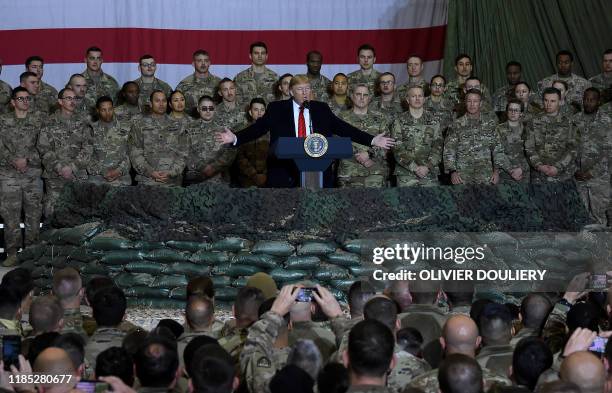 President Donald Trump speaks to the troops during a surprise Thanksgiving day visit at Bagram Air Field, on November 28, 2019 in Afghanistan.