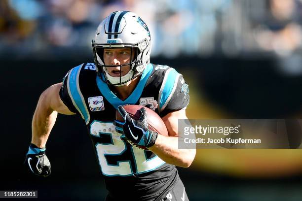 Christian McCaffrey of the Carolina Panthers runs with the ball in the second quarter during their game against the Tennessee Titans at Bank of...