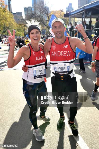 Amy Robach and Andrew Shue cross the finish line at the 2019 TCS New York City Marathon on November 03, 2019 in New York City.