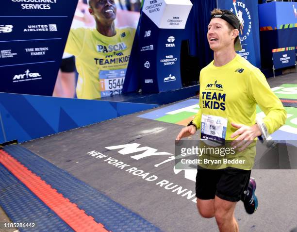 Ryan Briscoe crosses the finish line at the 2019 TCS New York City Marathon on November 03, 2019 in New York City.