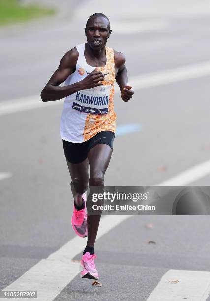 Geoffrey Kamworor of Kenya runs through Central Park before finishing first in the Mens' Professional Division in the TCS New York City Marathon on...