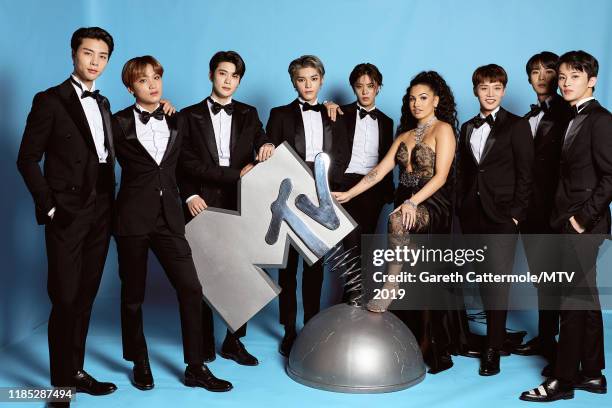 Johnny, Haechan, Jaehyun, Taeyong, Yuta, Mabel, Taeil, Doyoung and Mark of NCT 127 pose at the MTV EMAs 2019 studio at FIBES Conference and...