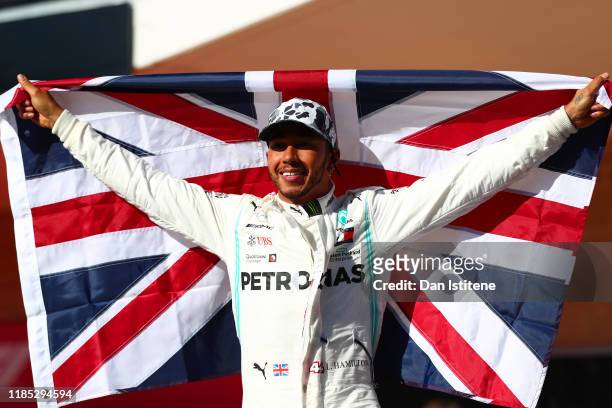 Formula One World Drivers Champion Lewis Hamilton of Great Britain and Mercedes GP celebrates in parc ferme during the F1 Grand Prix of USA at...