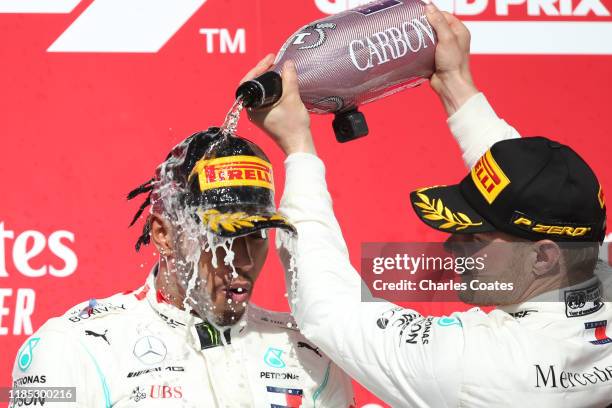 Race winner Valtteri Bottas of Finland and Mercedes GP, 2019 Formula One World Drivers Champion Lewis Hamilton of Great Britain and Mercedes GP and...