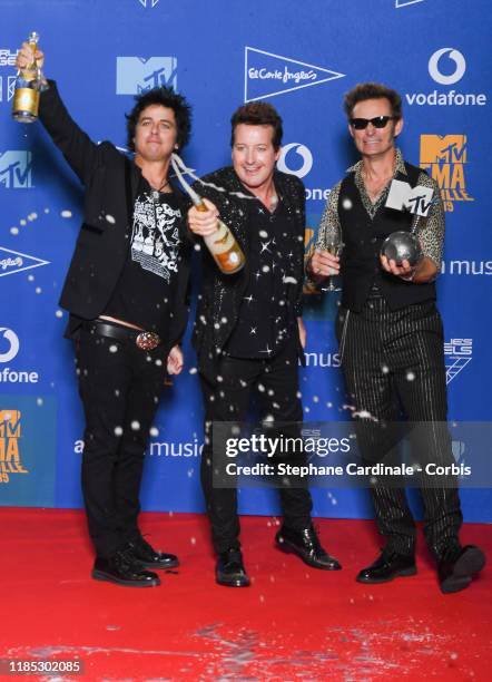 Billie Joe Armstrong, Tre Cool and Mike Dirnt from Green Day with the Best Rock Award in the winner room during the MTV EMAs 2019 at FIBES Conference...