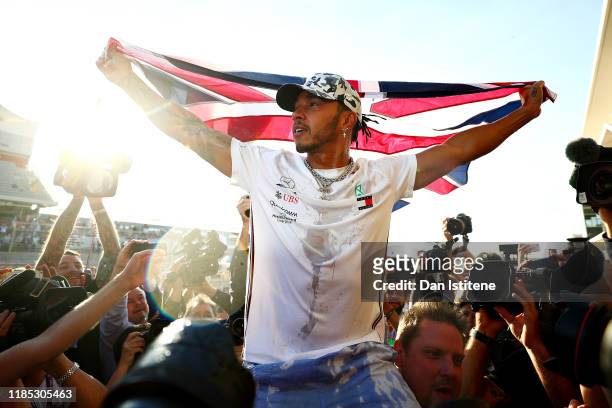 Formula One World Drivers Champion Lewis Hamilton of Great Britain and Mercedes GP celebrates after the F1 Grand Prix of USA at Circuit of The...