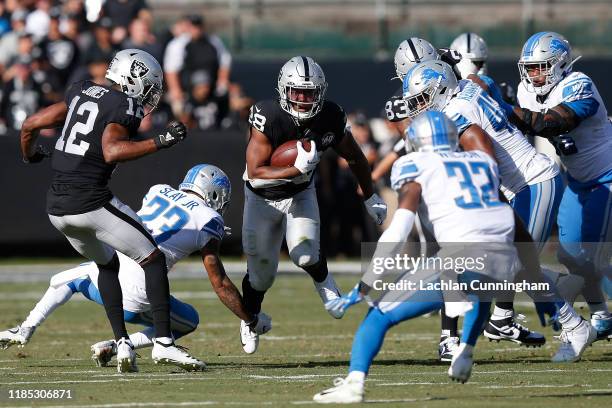 Josh Jacobs of the Oakland Raiders runs the ball in the second quarter against the Detroit Lions at RingCentral Coliseum on November 03, 2019 in...