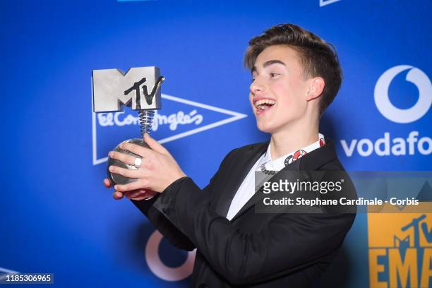 Johnny Orlando poses with Best Canadian Act Award in the winner room during the MTV EMAs 2019 at FIBES Conference and Exhibition Centre on November...