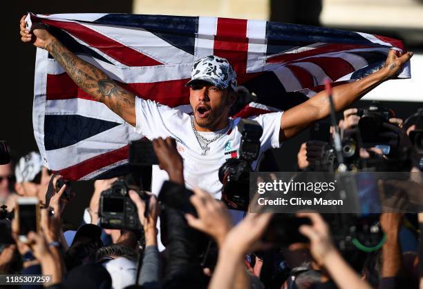 Formula One World Drivers Champion Lewis Hamilton of Great Britain and Mercedes GP celebrates after the F1 Grand Prix of USA at Circuit of The...