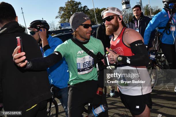 Roberto Mandje and Micah Herndon pose before the start of the 2019 TCS New York City Marathon on November 03, 2019 in New York City.