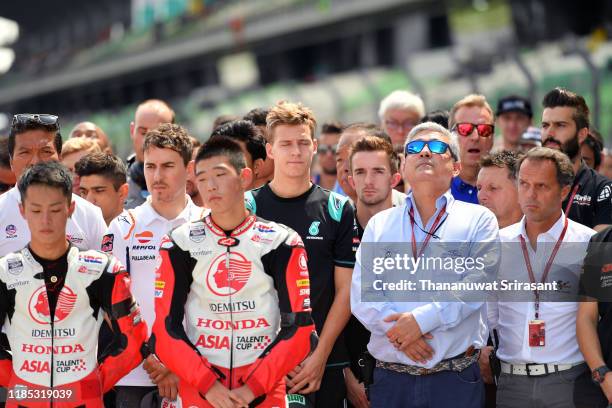 Riders and staffs observe a minute of silence for Afridza Munandar prior to the race of the MotoGP of Malaysia at Sepang International Circuit on...