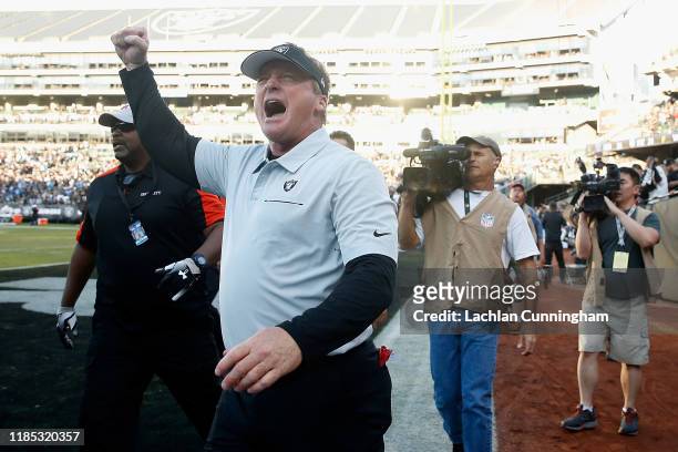 Head coach Jon Gruden of the Oakland Raiders celebrates with fans after a win against the Detroit Lions at RingCentral Coliseum on November 03, 2019...
