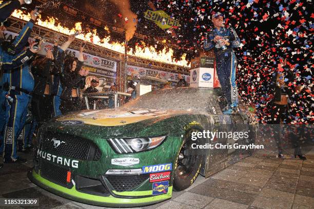 Kevin Harvick, driver of the Busch Beer/Ducks Unlimited Ford, celebrates in Victory Lane after winning the Monster Energy NASCAR Cup Series AAA Texas...