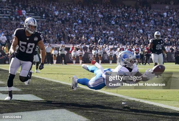 Marvin Jones of the Detroit Lions dives but can't hold onto this pass in the endzone against the Oakland Raiders during the first quarter of an NFL...