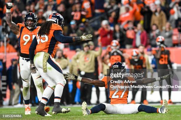 Davontae Harris of the Denver Broncos waves his arm after making key pass deflection on a ball thrown by Baker Mayfield of the Cleveland Browns on...