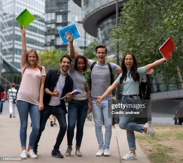 excited group of students celebrating an accomplishment with arms up - exchange student stock pictures, royalty-free photos & images