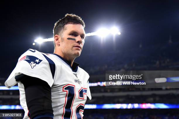 Quarterback Tom Brady of the New England Patriots looks on before playing against the Baltimore Ravens at M&T Bank Stadium on November 3, 2019 in...