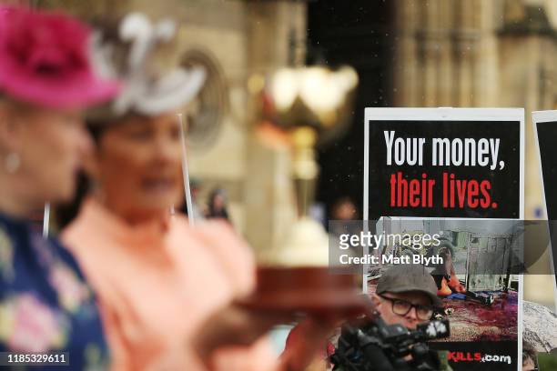 Horse activists protest as VRC Chairman Amanda Elliott and Lord Mayor of Melbourne Sally Capp display the Melbourne Cup during the 2019 Melbourne Cup...