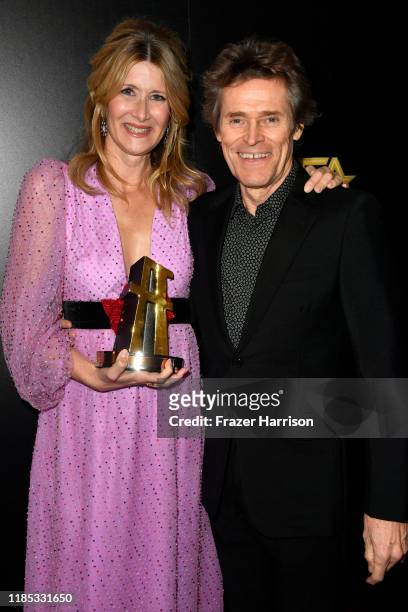 Laura Dern, winner of the Hollywood Supporting Actress Award poses in the press room with Willem Dafoe during the 23rd Annual Hollywood Film Awards...