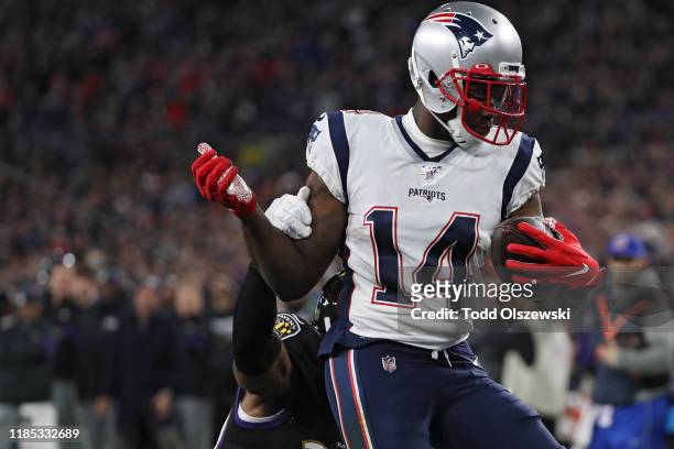 Wide receiver Mohamed Sanu of the New England Patriots scores a second quarter touchdown against the Baltimore Ravens at M&T Bank Stadium on November...