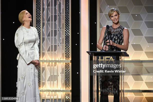 Nicole Kidman presents Charlize Theron with the Hollywood Career Achievement Award onstage during the 23rd Annual Hollywood Film Awards at The...