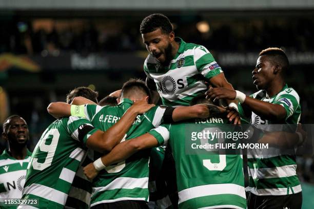 Sporting players celebrate teammate Brazilian forward Luiz Phellype's goal during the UEFA Europa League Group D football match between Sporting CP...