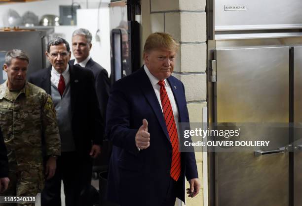 President Donald Trump makes a surprise Thanksgiving day visit with US troops stationed at Bagram Air Field, on November 28, 2019 in Afghanistan.