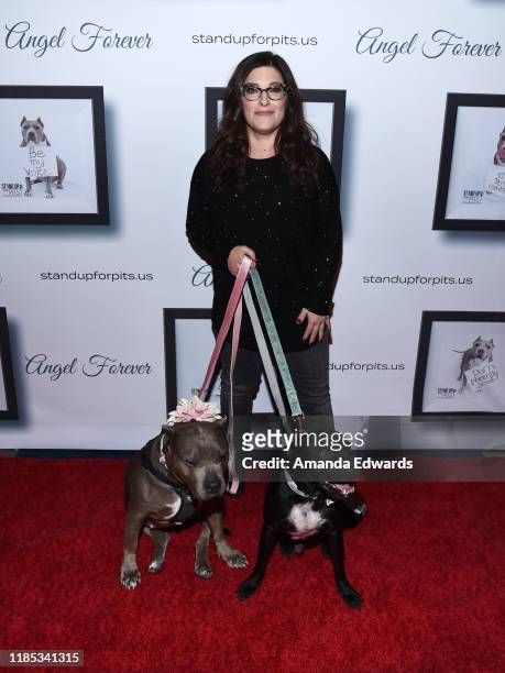 Rebecca Corry arrives with Sally and Todd the Pitbulls at the 9th Annual Stand Up For Pits event hosted by Kaley Cuoco at The Mayan on November 03,...