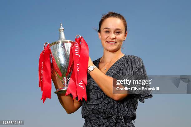 Ashleigh Barty of Australia poses for a photo with the Billie Jean King trophy following her victory in the Women's Singles final of the 2019...