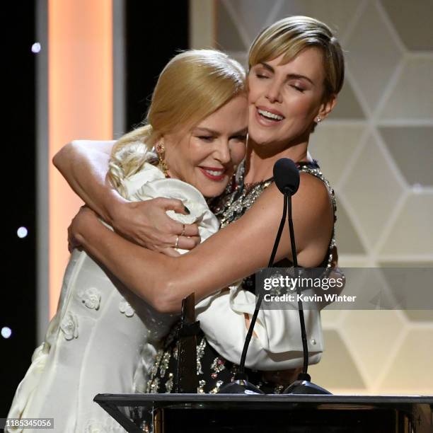 Nicole Kidman presents Charlize Theron with the Hollywood Career Achievement Award onstage during the 23rd Annual Hollywood Film Awards at The...