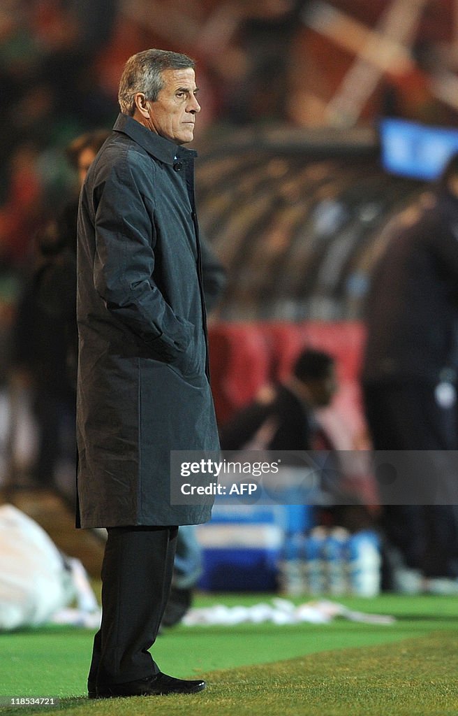 Uruguay's head coach Oscar Tabarez watch