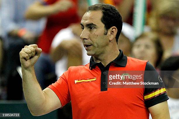 Captain Albert Costa of Spain celebrates a point as Feliciano Lopez of Spain plays Mardy Fish in their tie during the Davis Cup between USA and Spain...