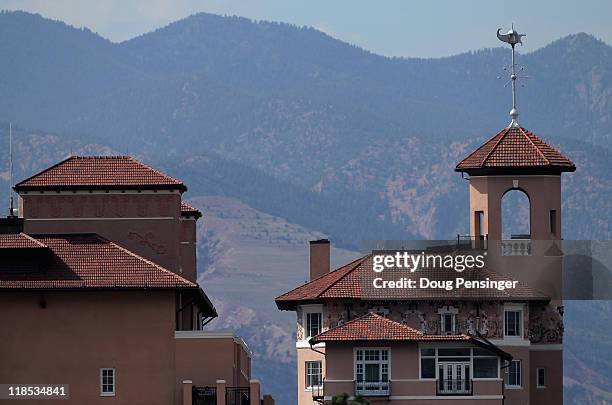 The Broadmoor resort towers above the trees with the Rocky Mountains as a backdrop as they host the U.S. Women's Open at The Broadmoor on July 8,...